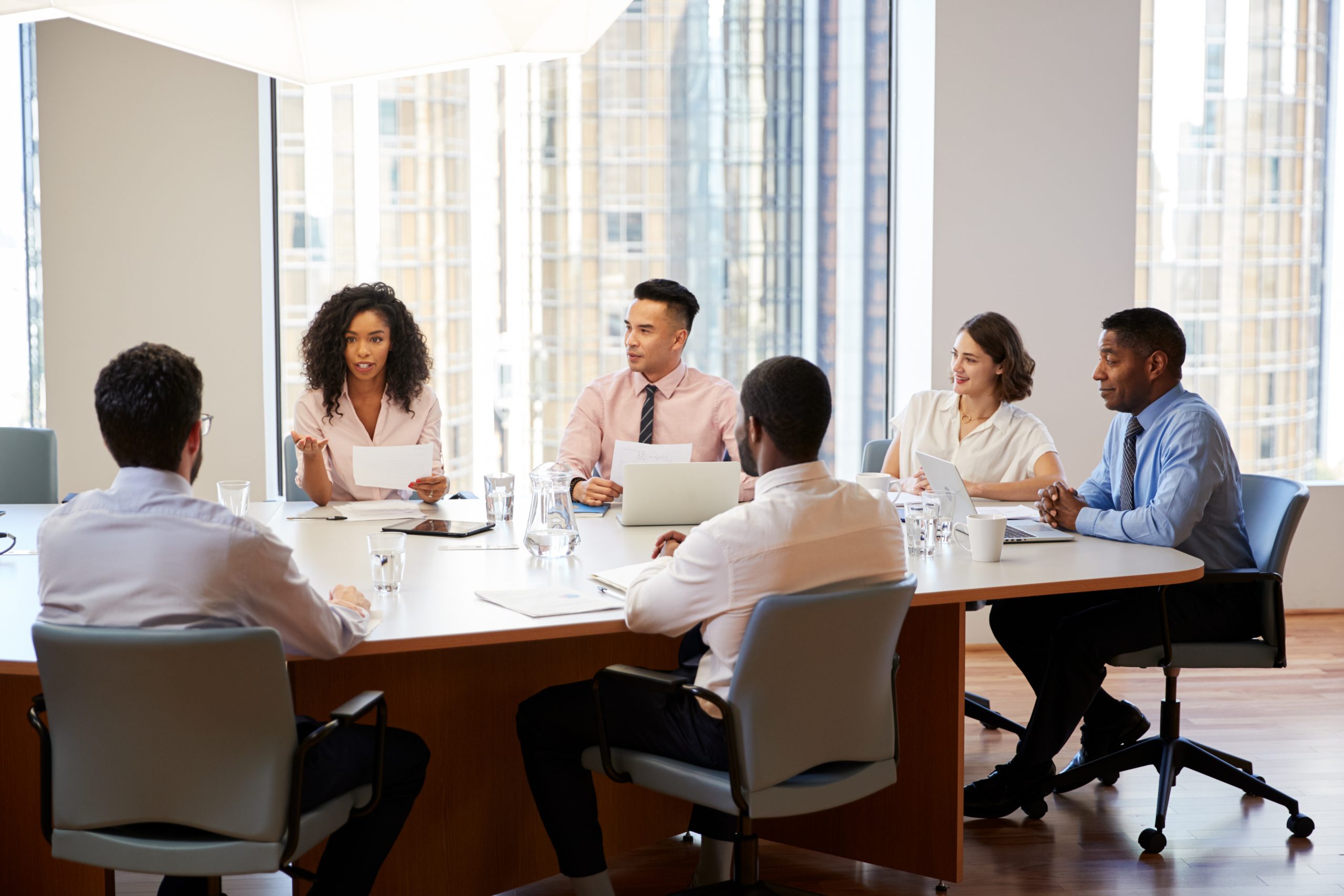 group of professionals having a meeting in a conference room