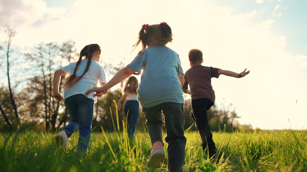 Children running in a field.