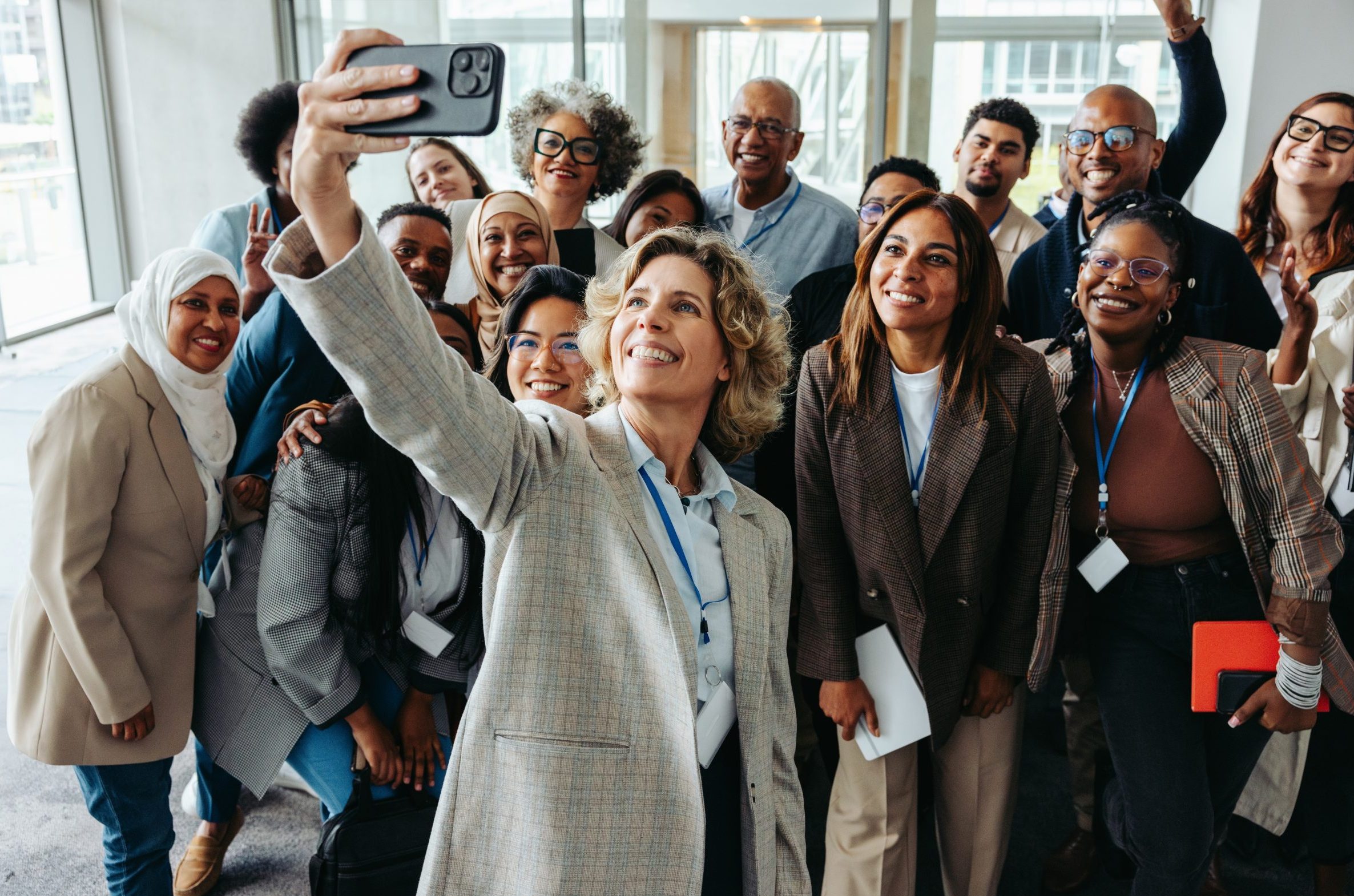 Diverse group of people taking a selfie.